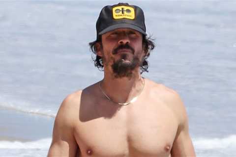 Orlando Bloom shows off a fit physique on the beach in Santa Barbara during the day